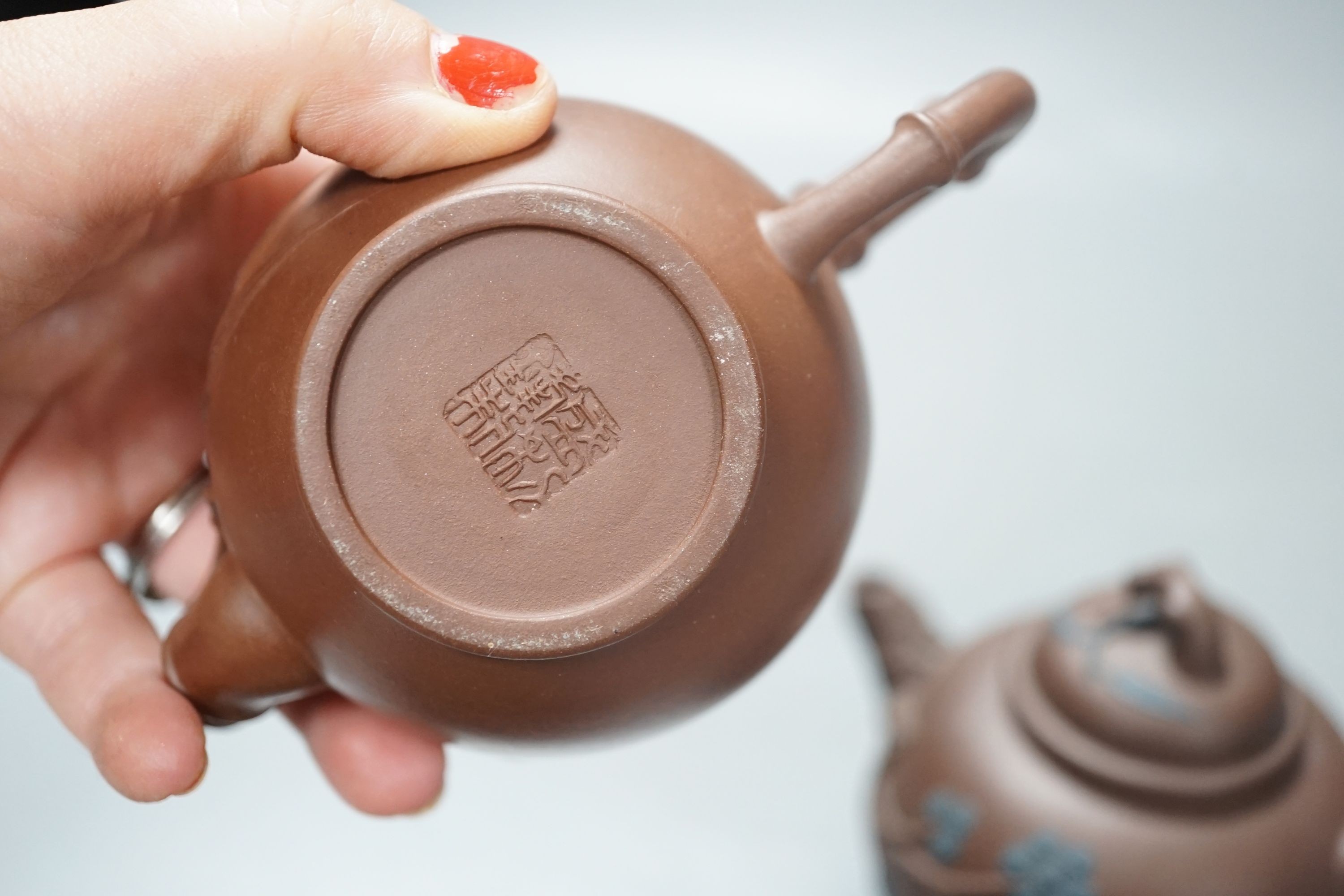 A group of four Yixing pottery teapots - tallest 11cm